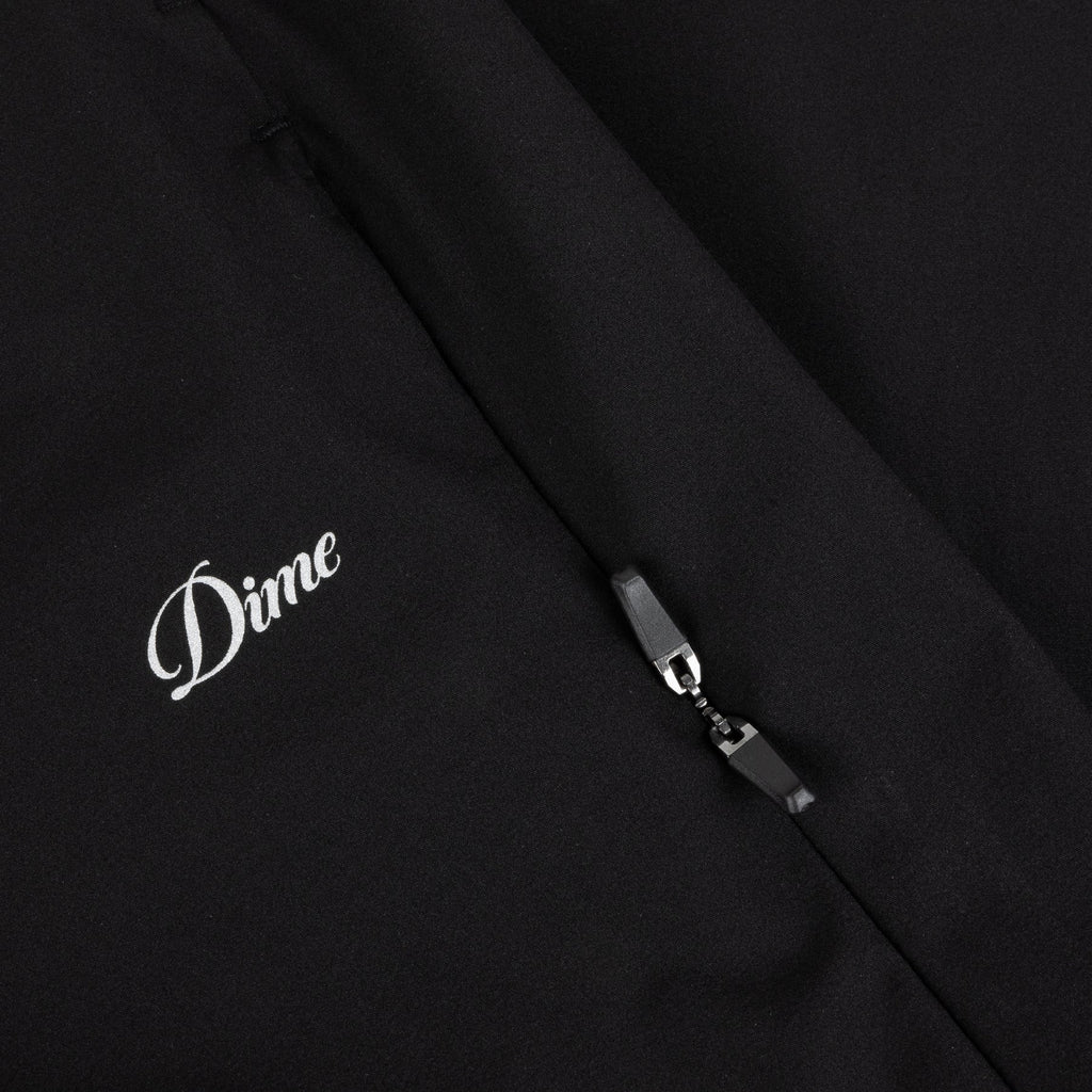 Pantalon Athletic Zip Dime MTL – coupe sportive, poches pratiques, zips discrets, logo 3M réfléchissant. Vue sur le logo imprimé