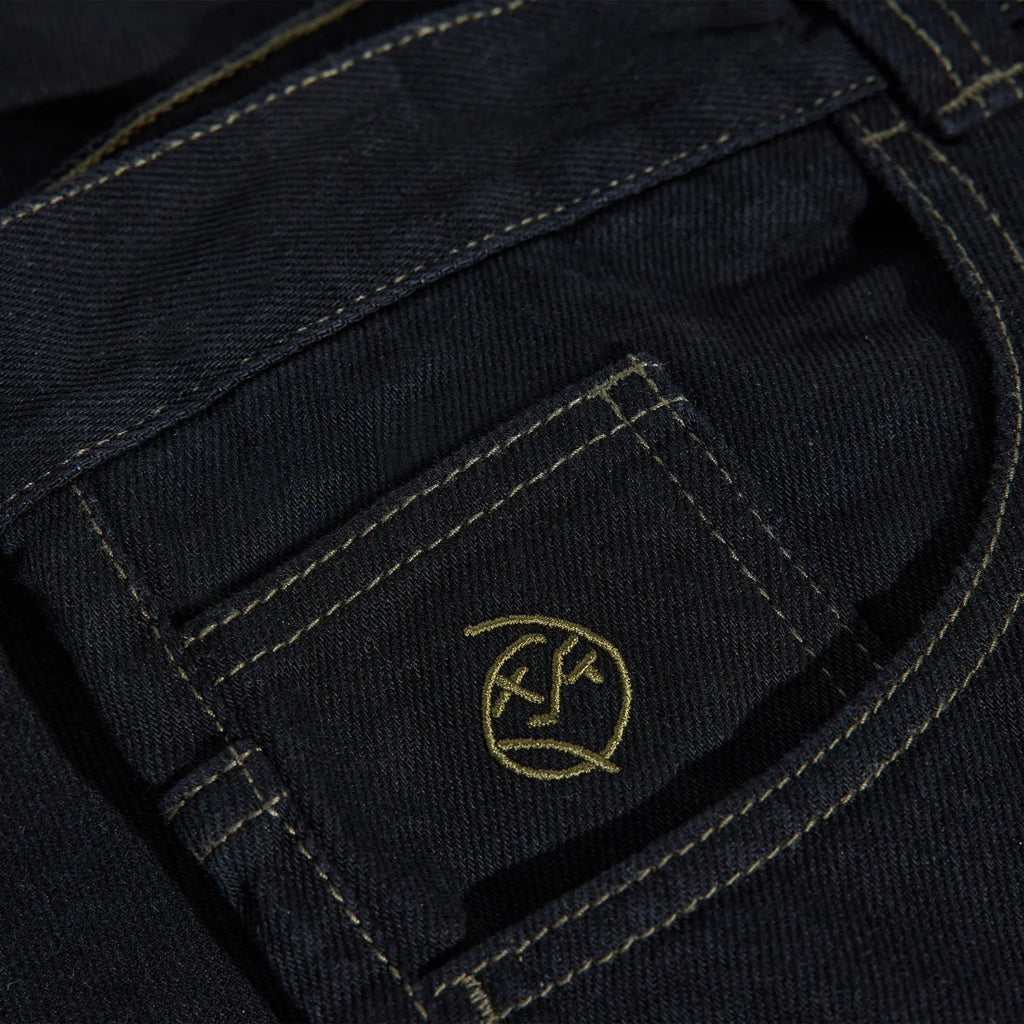 Pantalon Polar Skate Co. Big Boy Pants Black / Dark Olive en denim coton, coupe oversize skatewear – disponible à Mons. Zoom sur la broderie de la poche monnaie
