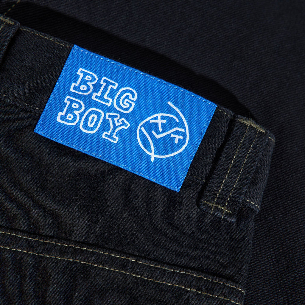Pantalon Polar Skate Co. Big Boy Pants Black / Dark Olive en denim coton, coupe oversize skatewear – disponible à Mons. Zoom sur l'étiquette ceinture