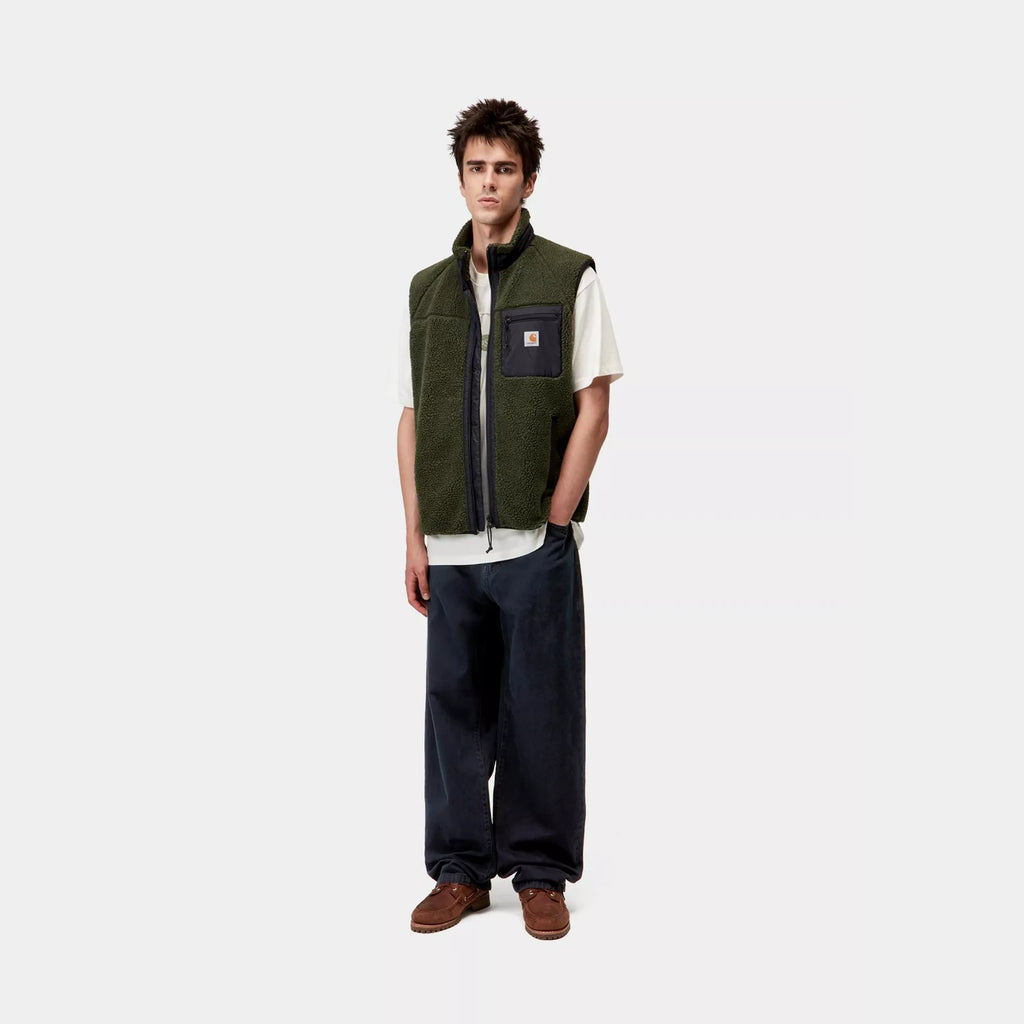 Carhartt WIP Landon Pant denim coupe loose tapered midnight wash – skateshop Mons. Vu de face porté par un mannequin en entier